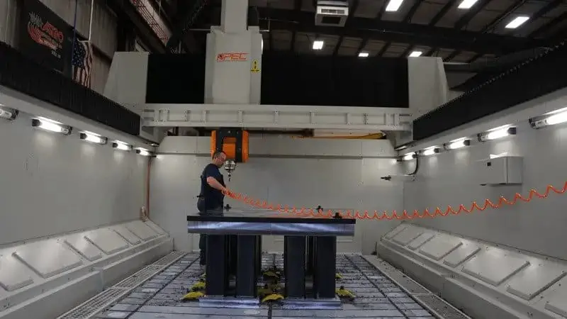 Astro Employee Operating 5-Axis Machine Astro Employee Operating 5-Axis Machine